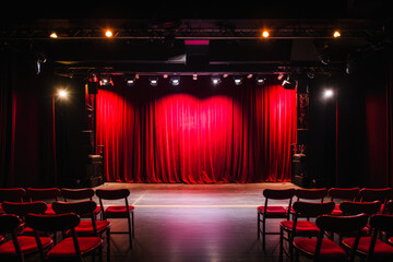 A view of an empty stage of a comedy club with open mic, waiting for performers, theatre with plain chairs. Nobody