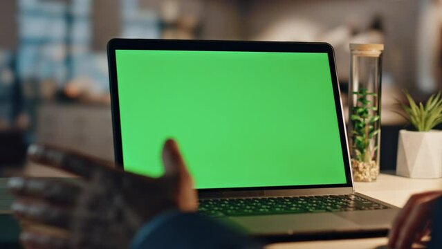 Closeup businessman having videocall at green screen computer in night office