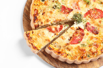 Tasty quiche with tomatoes, microgreens and cheese on white background, top view. Space for text