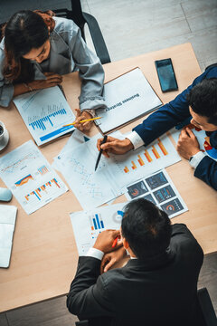 Business People Group Meeting Shot From Top View In Office . Profession Businesswomen, Businessmen And Office Workers Working In Team Conference With Project Planning Document On Meeting Table . Jivy