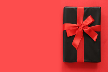 Gift box on red background. Black Friday
