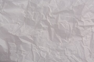 Texture of crumpled parchment paper as background, top view