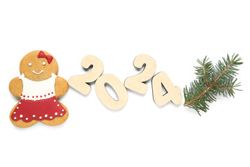 Tasty Christmas cookie in shape of girl and figure 2024 on white background