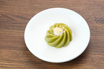 Kue Kaswi Pandan, traditional cake made from tapioca flour and pandan leaf, topping with sesame seed
