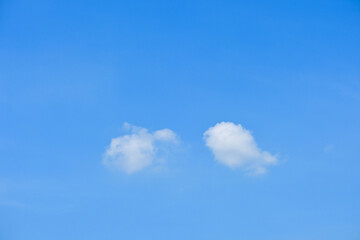 beautiful blue sky and white fluffy group of clouds with sunrise in the morning, natural background