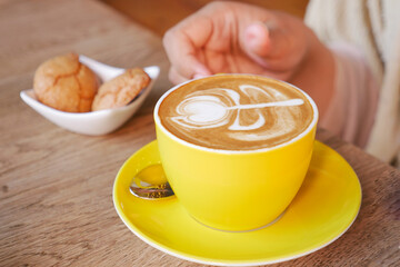 women holding a coffee cup 