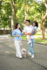 Obraz premium Photo of young Asian family at park