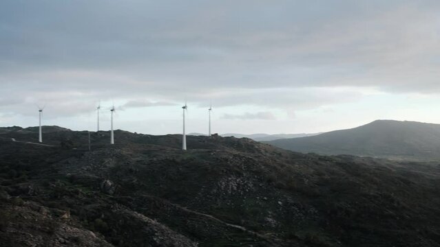 Landscape view from Sortelha Castle in Portugal with wind turbines, pan right