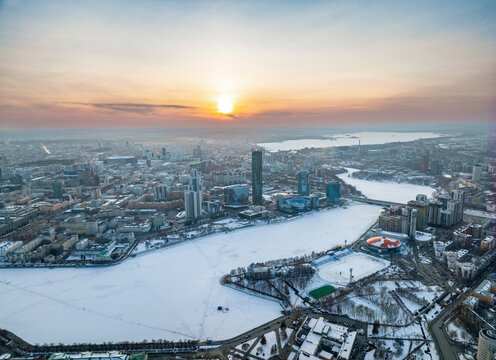 Embankment of the central pond and Plotinka in Yekaterinburg at winter sunset. The historic center of the city of Yekaterinburg, Russia, Aerial View