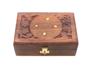 an antique jewellery box or treasure chest, decorated with wood carvings isolated in a white background