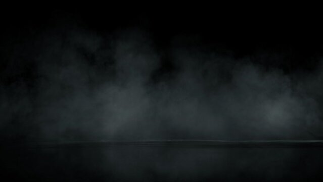 Super Slow Motion Shot of Atmospheric Smoke Slowly Floating on Black Background at 1000fps.