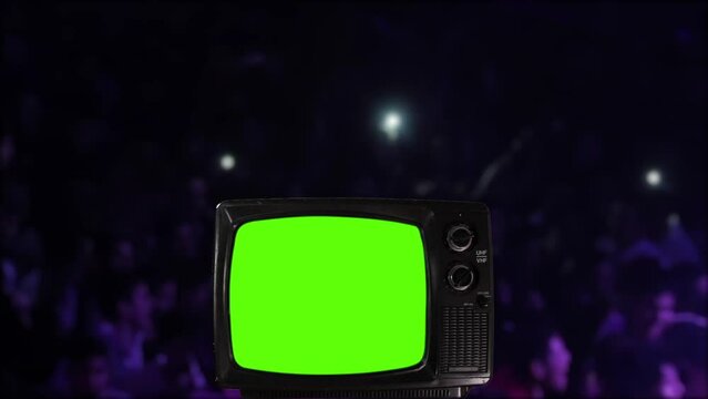 Old TV Turning On Green Screen with a Nightclub in the Background.  You can replace green screen with the footage or picture you want with “Keying” effect in After Effects.