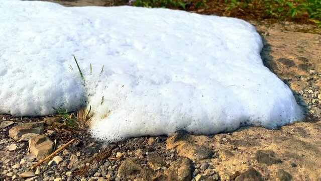 Foam on concrete surfaces. The contents of a foam type fire extinguisher