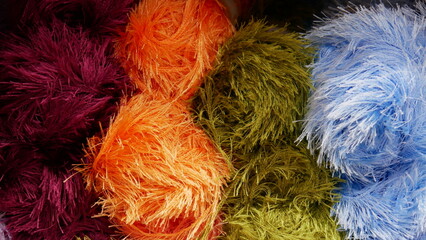 Close-up of many balls of colorful yarn