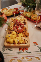 close up top view of a Christmas New Year's Eve decorated table with appetizers, dishes