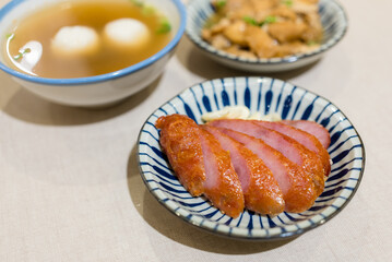 Slice of roasted sausage on the plate