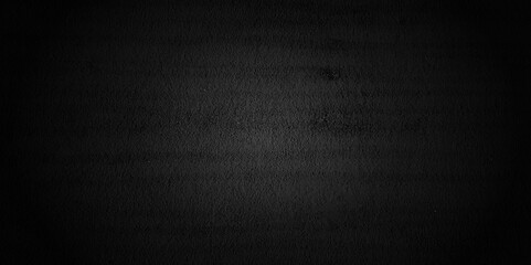 Old black concrete wall texture. Grunge background. Dark wallpaper