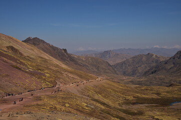 Large group of people hiking towards Rainbow mountain in Peru