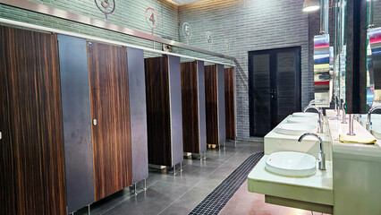 Row of public toilet modern design interior, Modern Public Restroom, lavatory, water closet and...