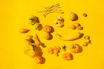 Yellow vegetables on the yellow background