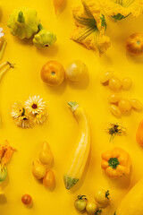 Yellow vegetables on the yellow background