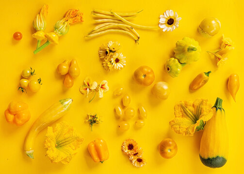 Yellow vegetables on the yellow background