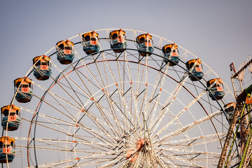 Closeup of multi-coloured Giant Wheel during Dussehra Mela in Delhi, India. Bottom view of Giant...