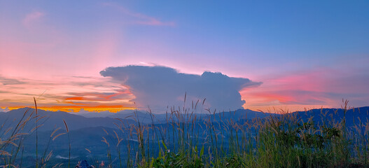 Large clouds that has a wonderful and beautiful shape Landscape mountain twilight sunset. Banner...