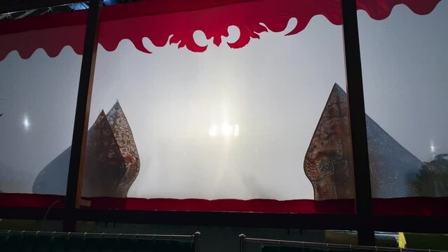 Silhouette of wayang kulit or shadow puppets from Java, Indonesia puppet show by puppeteer