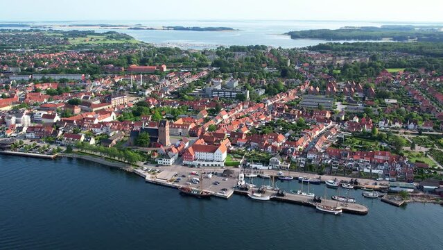 Aerial fly over the harbor and village of Middelfart Denmark during summer