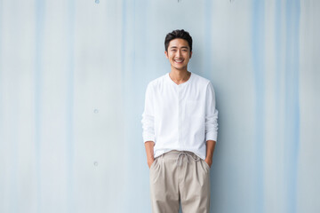 Young japanese man in white shirt and pant. - obrazy, fototapety, plakaty