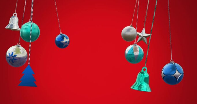 Animation of baubles, bells, tree and star hanging against red background