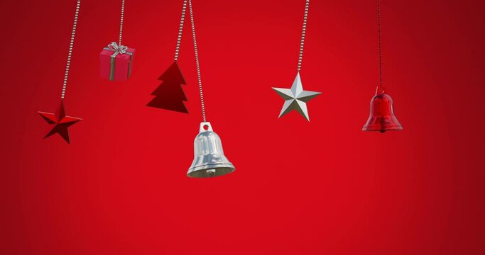 Animation of bells, star, gift box swinging against red background