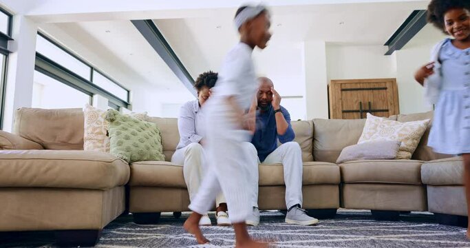 Jump, children parents on a sofa with stress, headache or depression at home with mental health crisis. Energy, chaos and people in living room overwhelmed by hyper kids, adhd or parenting burnout