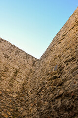 walls of the old castle against the blue sky