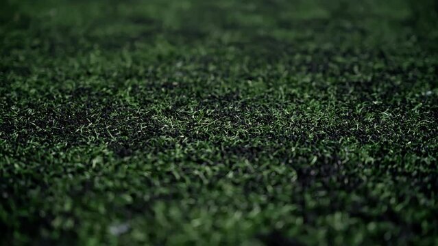 Artificial green grass on a football field.