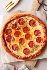 Pizza with pepperoni and cheese. Fast food. Italian cuisine. American food.
