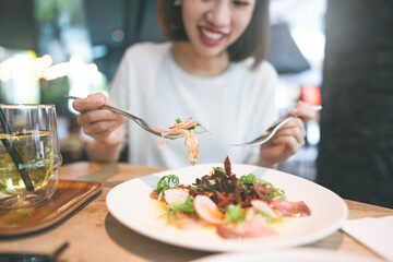 Japanese food Sashimi tuna salad asian foodie woman background at indoor restaurant on day
