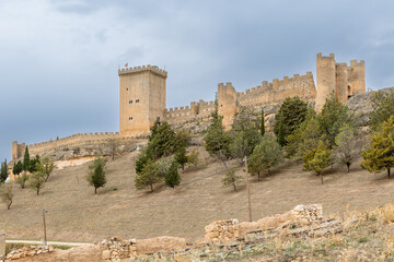 Peñaranda de Duero, Spain - October 13, 2023: ruins of the medieval castle in the town of Peñaranda de Duero in the province of Burgos, Spain - obrazy, fototapety, plakaty