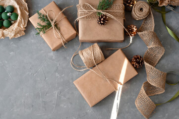 Sustainable Christmas celebration, preparation of presents. Homemade wrapping of gift boxes with...