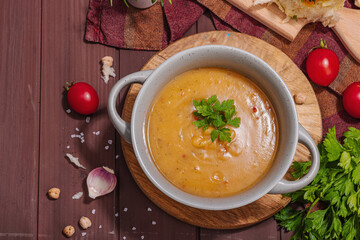 Chickpea-tomato cream soup with fragrant garlic buns. Comfort food, nostalgic mood concept