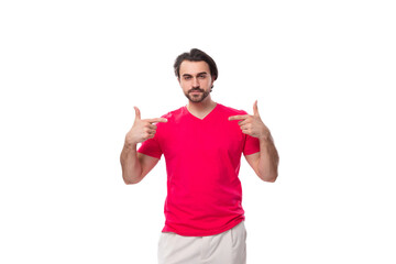 Fototapeta premium young slender brunette advertiser man dressed in a red t-shirt. corporate color concept