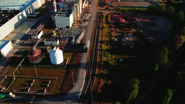 A semi-truck drove through the tissue factory area. Aerial shot factory industry.