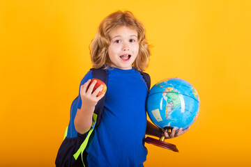 School boy world globe and apple. School kid 7-8 years old with book go back to school. Little student. Education concept.