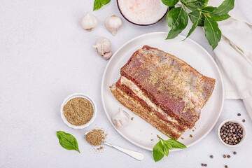 Piece of salty high-fat meat cooked with spices. Salo, bacon, lard, silverside, gammon