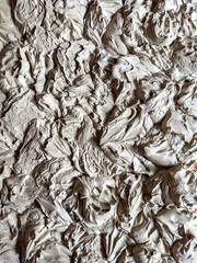 Top down full frame image of wet clay for ceramics 