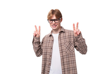 young friendly man with red hair shows welcome gesture