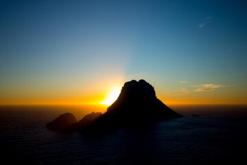 Beautiful sunset at Cala d'hort with Es Vedra island beach in Ibiza, Spain.