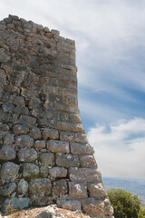 High  corner protective stone wall in the medieval fortress of Nimrod - Qalaat al-Subeiba located near the border with Syria and Lebanon in the Golan Heights, northern Israel