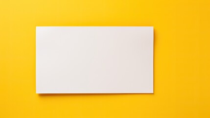 Fototapeta premium Directly above view of blank cardboard banner on yellow background. 